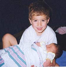 holding-feature-225-228-cloned-9k.jpg (8727 bytes)