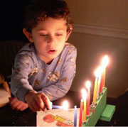 Lighting his own menorah